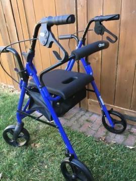 Rolling walker (rollator) with seat and hand brakes