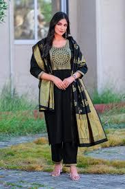 How do you style black suits creatively today?